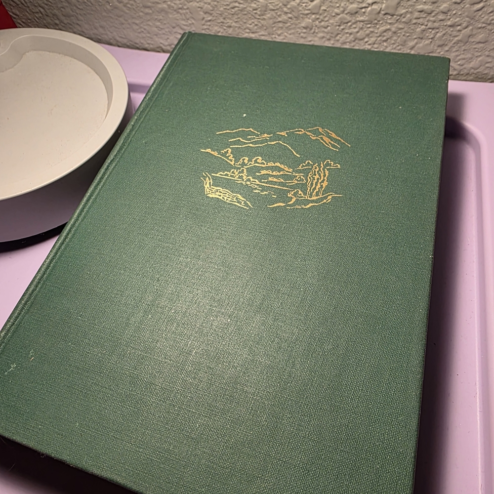 Green Hardcover Book with Gold Design